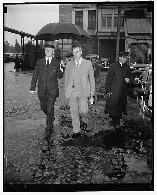 Cabinet member brave rain to greet chief. Washington,...