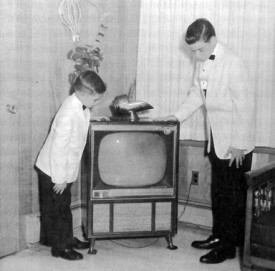 Robert's sons in front of a television he invented.
