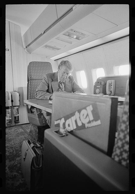 [Jimmy Carter working aboard "Peanut One" campaign airplane]