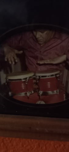 Papi playing the congas