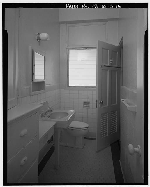 Interior view of bath 1 showing original cabinet and bath...