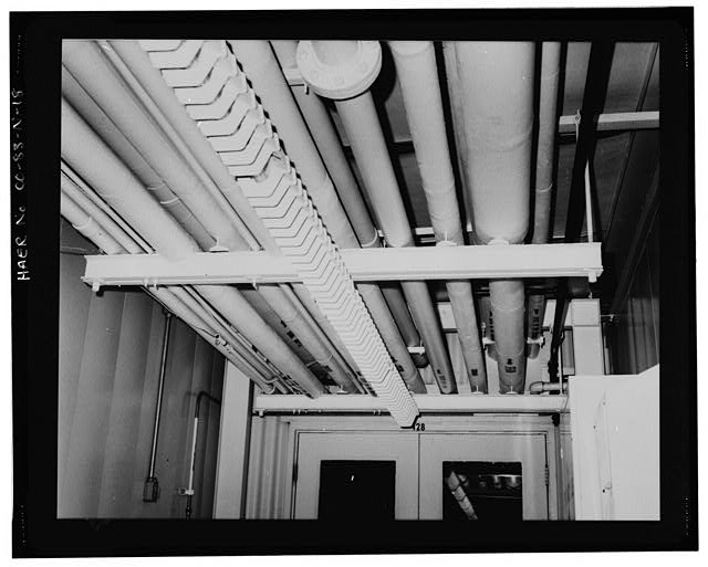 18. VIEW OF THE CEILING, THE PIPING TRANSPORTED CHEMICALS...