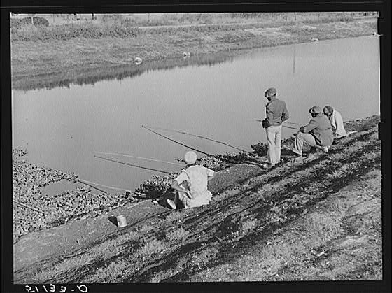 Migratory workers fishing to eat. Belle Glade, Florida