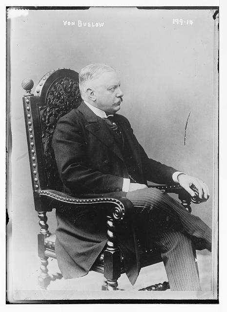 von Buelow, seated in chair