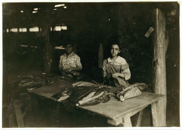 Young girls of 11, 12, 13 yrs., string in shed of...