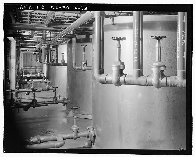 73. View of line of stainless steel coolant storage tanks...