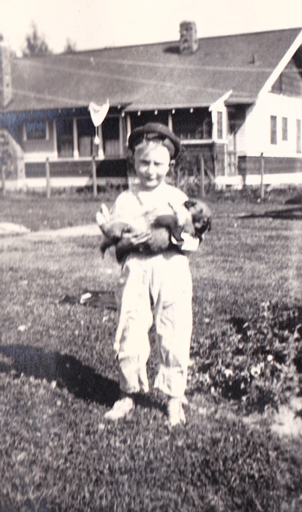 Boy holding a puppy