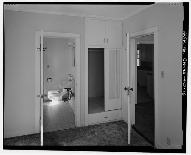 16. INTERIOR OF NORTH BEDROOM SHOWING FOUR-PANEL DOORS TO...