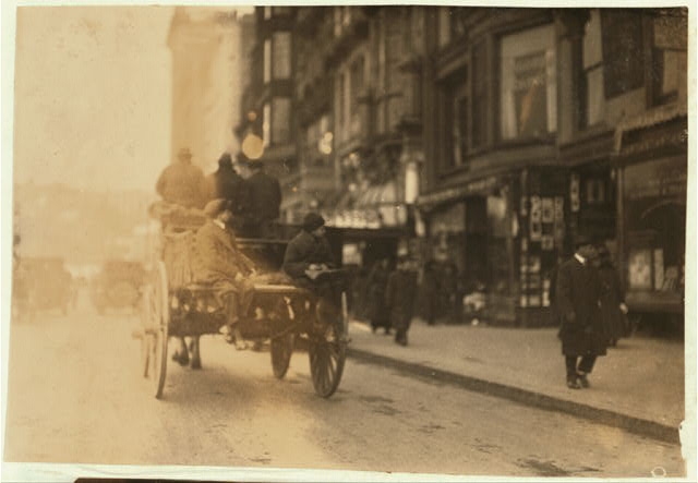 P.M. Delivery boys on Tremont Street, "getting a hitch"....