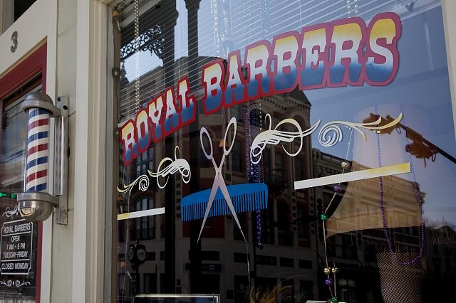Royal Barbers window on Royal Street in Mobile, Alabama
