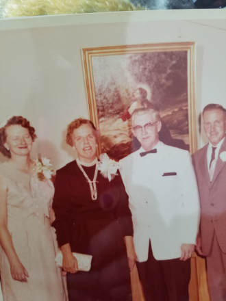 Mystery couple. The couple in the middle are my grand parents. Unknown couple on the ends. 