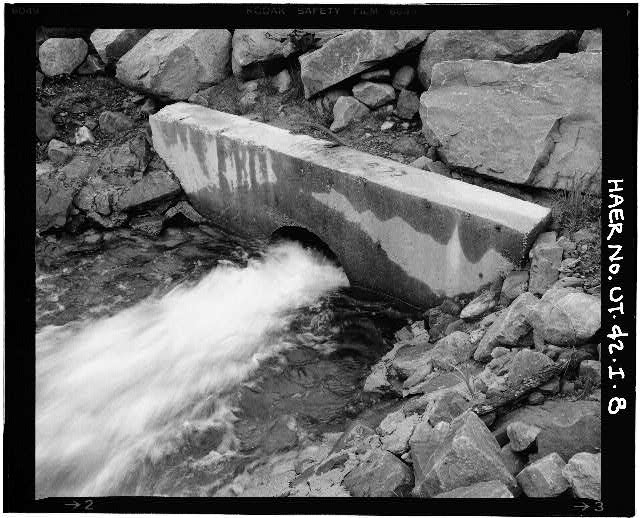 8. VIEW OF OUTLET PIPE AND CONCRETE COLLAR, LOOKING WEST...