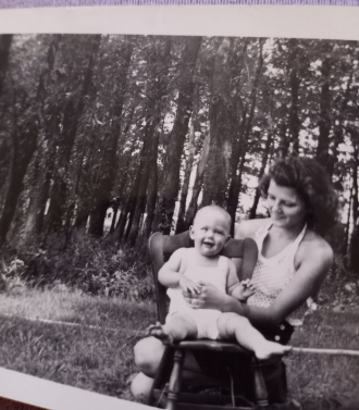 Unknown Lady and a child. With the other photo I have. With the man. Maybe the baby is a boy ? 
