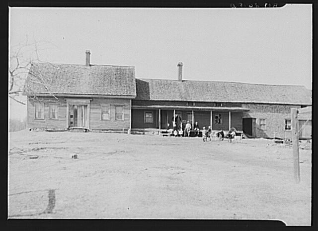 Front view of farmhouse and connecting buildings of...