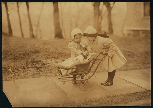 Children playing with Campbell kid dolls. Location: New...