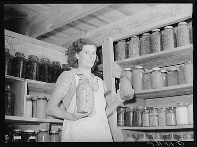Mrs. Lawrence Corda, wife of tiff miner, with some of her...