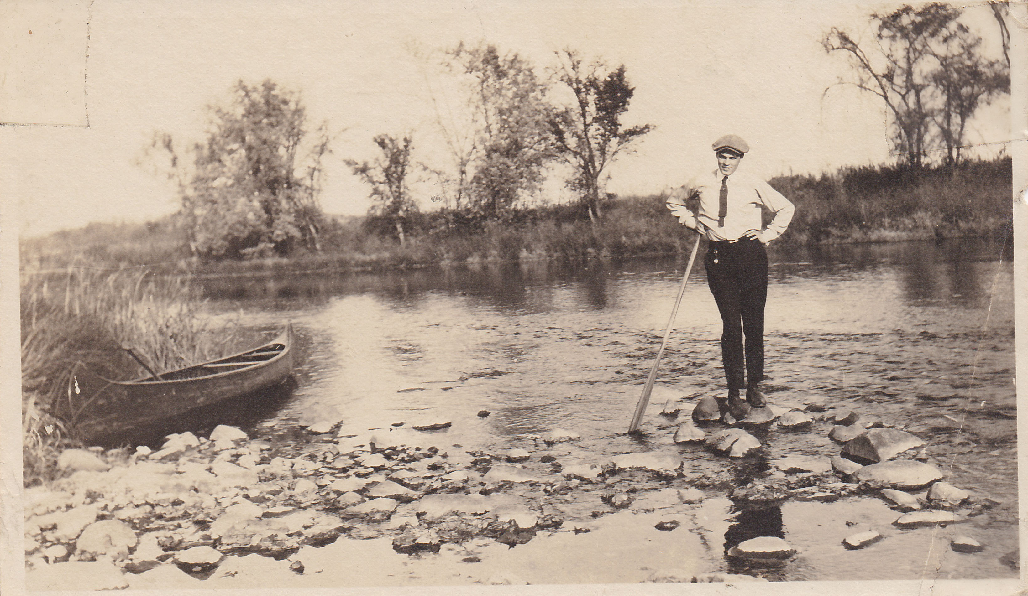 Man with tie and canoe (Found Photo 2)