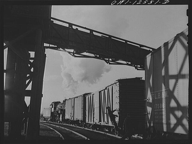 Chicago, Illinois. Switchman riding a car in a flat...