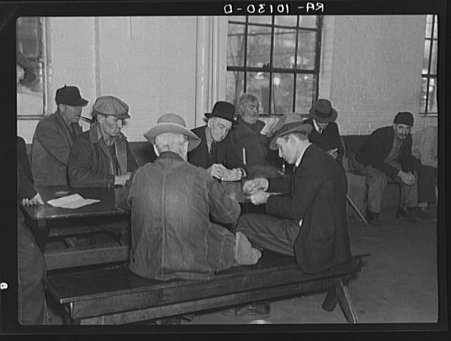 A card game in the recreation room of the homeless men's...