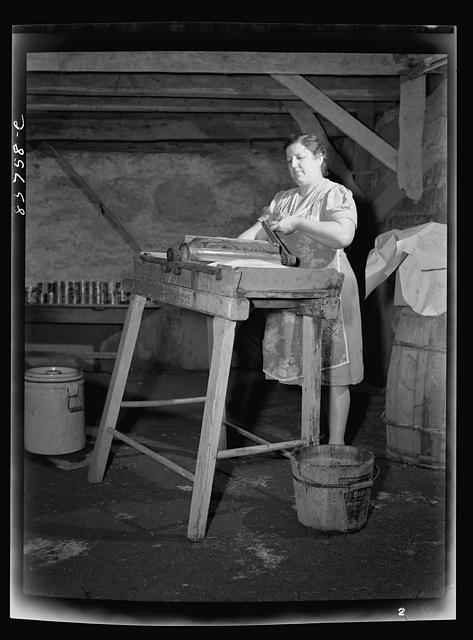 Fort Kent, Maine (vicinity). Mrs. Gagnon wringing water...