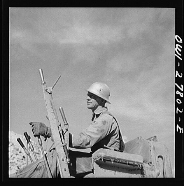 Morenci, Arizona. Bulldozer operator at an open-pit...