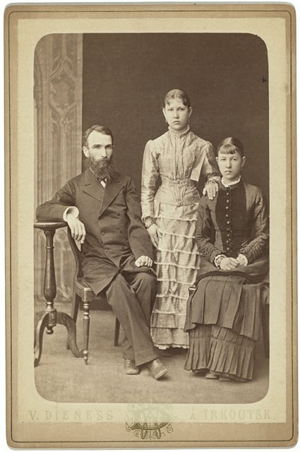 [Family portrait of an unidentified man and his two...