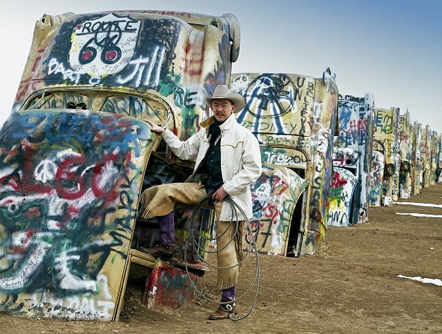 Cowboy at the funky Cadillac Ranch, U.S. Route 66,...