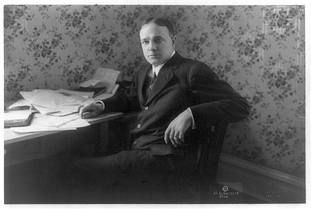 [Billy Sunday, three-quarter length portrait, seated at...