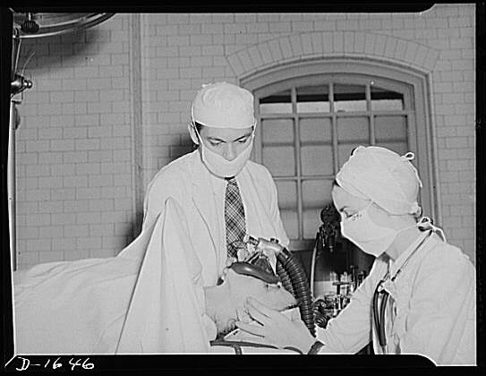 Graduate register nurse, above, receives instruction in...