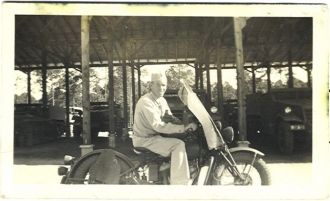 James Wesley  Holcomb on a motorbike