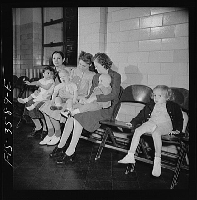 Greenbelt, Maryland. Mothers waiting with their children...