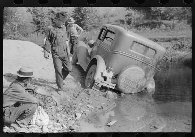 Mountaineers trying to get car out of creek. Up South...