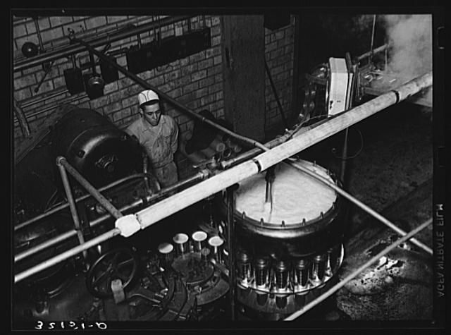 Canning machine. Grapefruit juice cannery, Weslaco, Texas