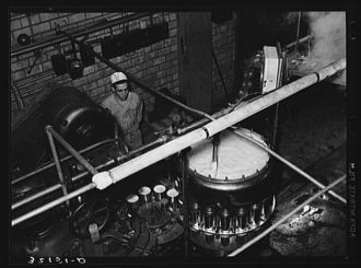 Canning machine. Grapefruit juice cannery, Weslaco, Texas