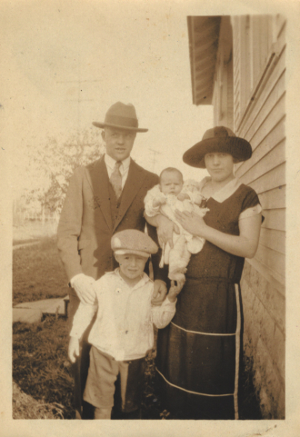 Two adult, a child, and a baby Two adult, a child, and a baby