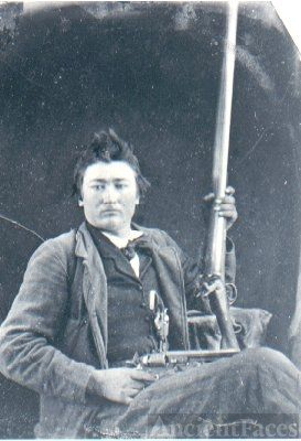 Possible Cherokee Man w/long gun & revolver