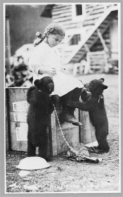 Girl with bear cubs
