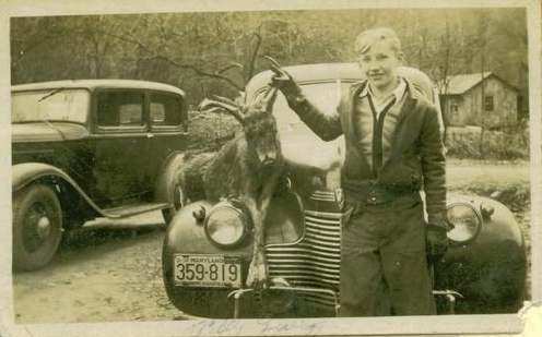 Billy with deer on car
