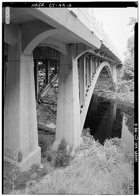 2. VIEW FROM RIVERBANK TO CONCRETE PIERS AND STEEL ARCH...