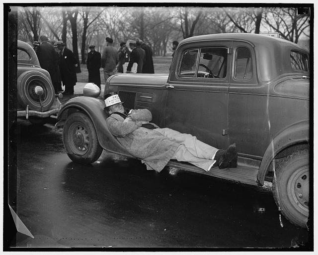 Striking Seamen naps as mates picket Commerce Department....