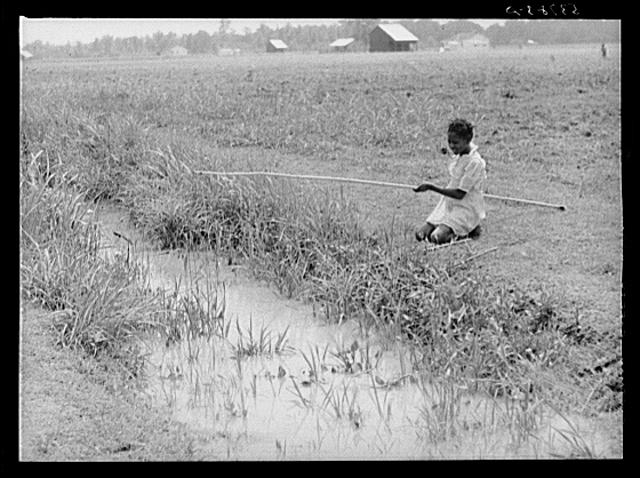 Negro girl fishing in ditch. La Delta Project, Louisiana