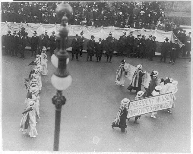 Suffragettes parading