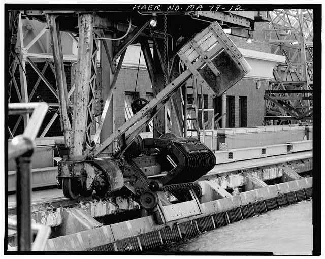 12. VIEW OF TRASH RAKE IN RAISED POSITION AFTER HAVE...