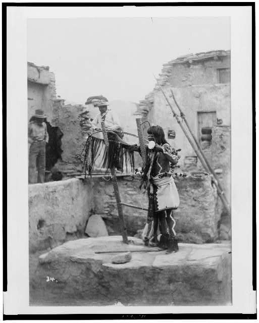 Ni-ha-poo-ma, an antelope priest, removing the...