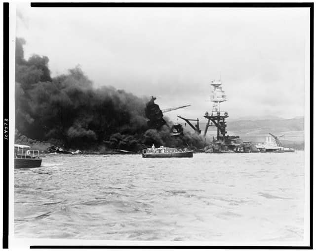 USS Arizona, at height of fire, following Japanese aerial...