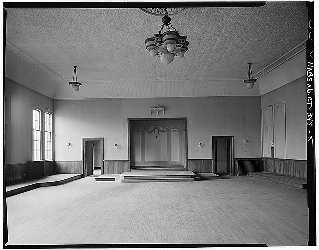 5. WEST END OF LARGE HALL ON THIRD FLOOR SHOWING STAGE -...