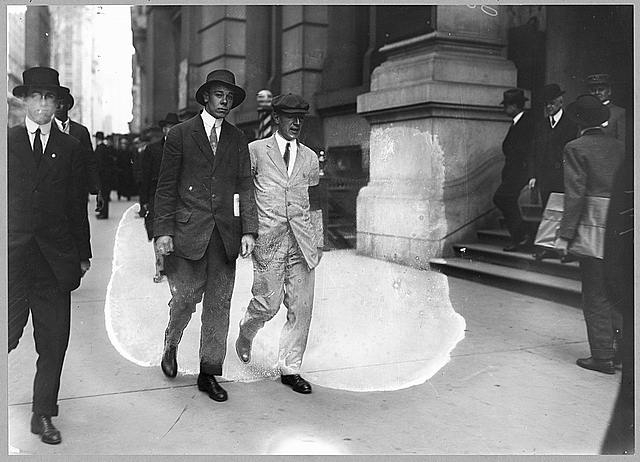 [Author Upton Sinclair, in white suit with black arm...