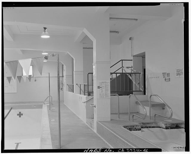 Swimming pool. View of aisle between swimming pool and...
