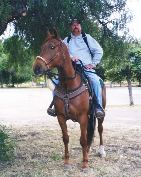 Charlie Ralph Merrill on horseback