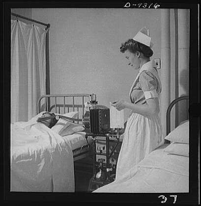 Nurse training. A student nurse gives a patient a...